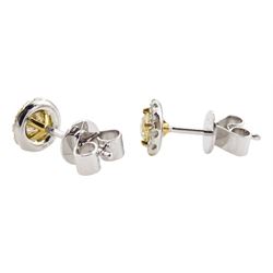Pair of 18ct gold white and yellow diamond cluster stud earrings, total diamond weight 0.64 carat, with World Gemological Report