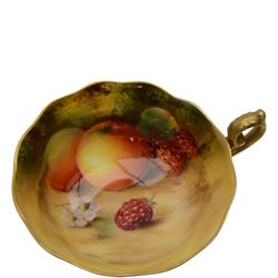 Royal Worcester fruit painted cabinet teacup and saucer, interior hand painted with apples, blackberry and cherries upon a mossy ground, the cup exterior and centre of saucer gilded, cup and saucer signed Rickells, each with puce coloured printed marks beneath, H7cm