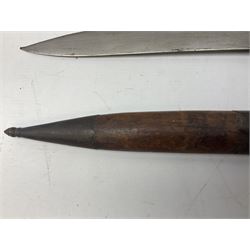 Burmese dha dagger with 15cm steel blade, white metal ferrule and horn handle, in white metal and filigree scabbard L30.5cm; a Burmese long bladed knife with horn handle and brass mounted teak scabbard; and another Eastern dagger in sheath (3)