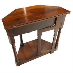 Gothic Revival oak fold-over console table, of octagonal form when unfolded, carved frieze with full length undertier 