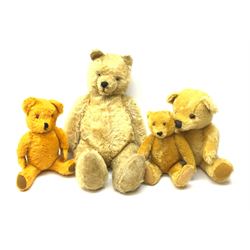 Four 1950s English/European teddy bears including an orange plush wind-up musical bear with swivel jointed head, glass type eyes, vertically stitched nose and mouth and jointed limbs with felt paw pads H19