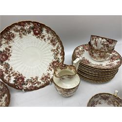 Victorian tea service for twelve decorated with floral and gilt design borders upon plain ground with scalloped edge comprising twelve teacups and saucers, twelve plates, milk jug and bowl, two sandwich plates and further coffee cup, saucer and plate, with impressed and printed marks beneath