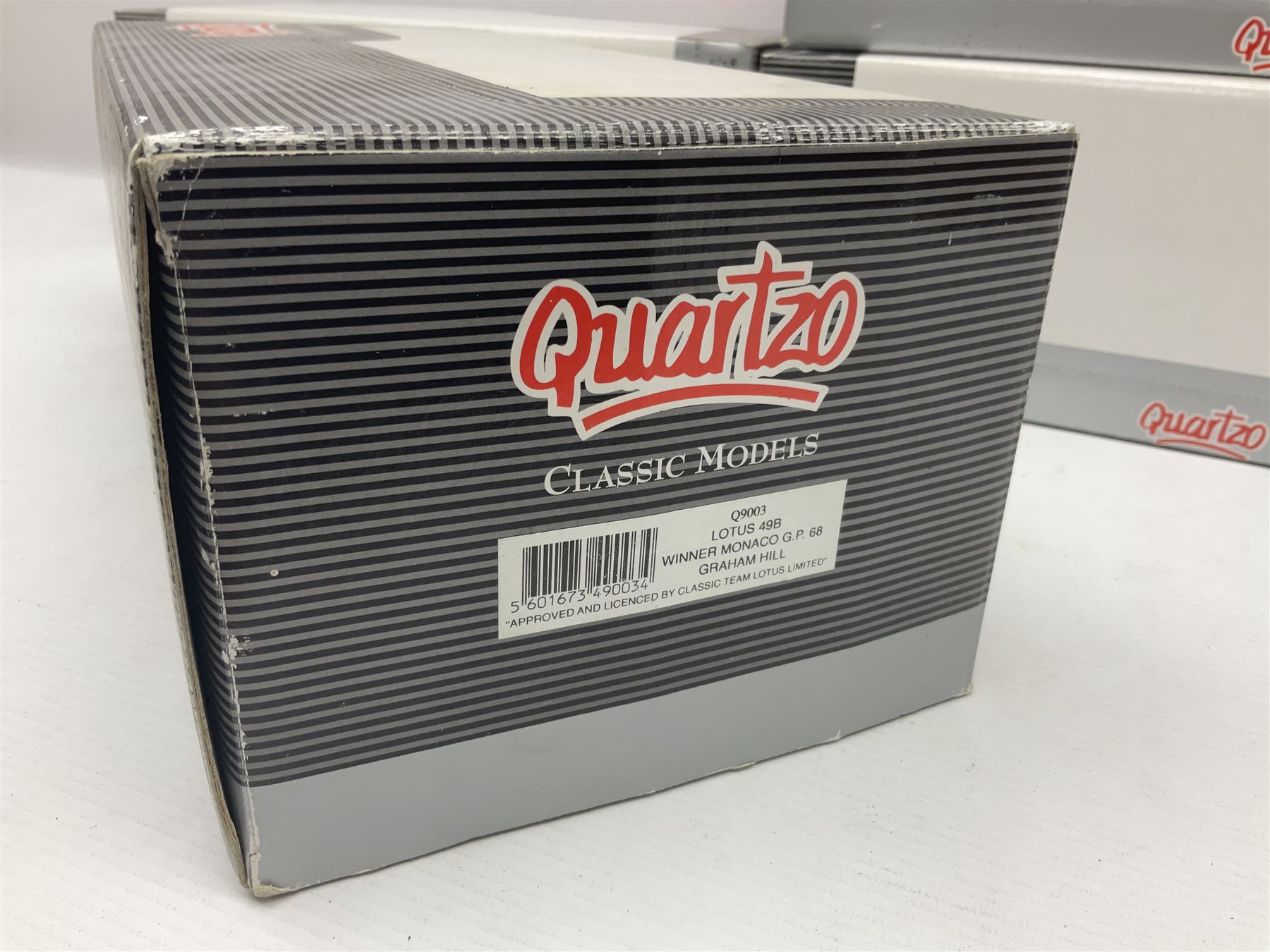 Four Quartzo/A-Model 1:18 scale die-cast racing cars - Lotus 72D 'JPS' Winner British G.P. 72 Emerson Fittipaldi; Lotus 49 Winner British G.P. 67 Jim Clark; Lotus 49B U.S.A. G.P. 68 Mario Andretti; and Lotus 49B Winner Monaco G.P. 68 Graham Hill; all boxed (4)