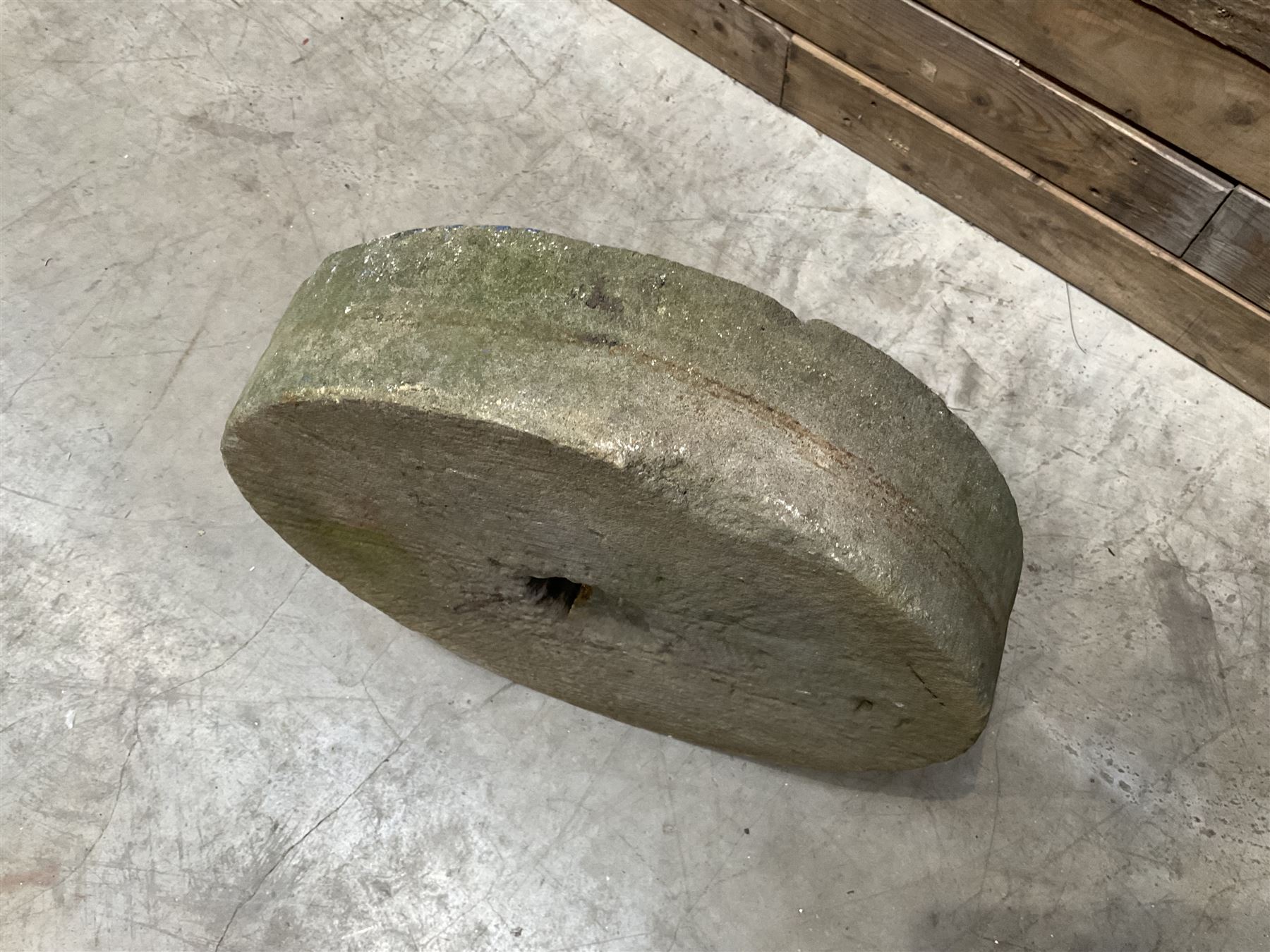 19th century circular stone mill wheel,