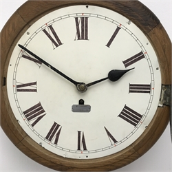  Early 20th century oak cased wall clock, white Roman dial with red arrow markers with plaque for W.E.Boddy Kirbymoorside, single fusee movement, D39cm  