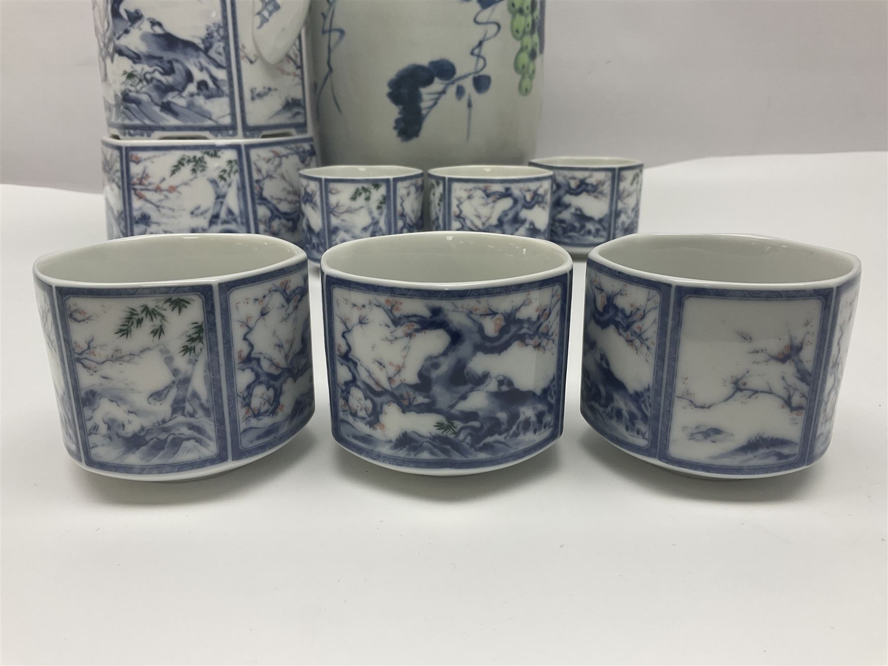 Chinese vase, decorated with vines and grapes and signed beneath, together with Chinese tea set of hexagonal form, comprising teapot and stand and six cups, vase H30cm