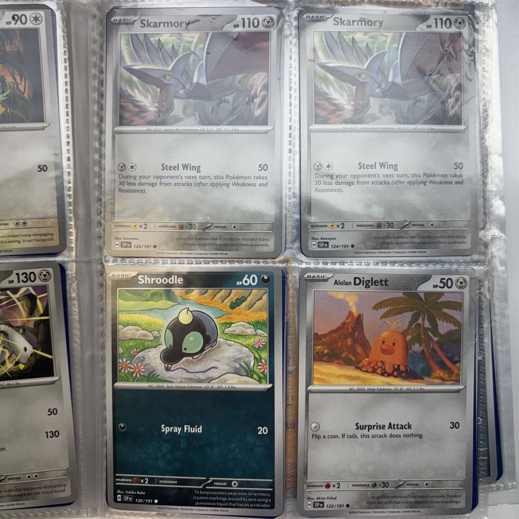 Collection of modern Pokemon TCG trading cards from the Scarlet & Violet and Sword & Shield eras, contained within in two folders, opened packets and loose, together with a graded Sword & Shield Silver Tempest Passiman TG08, GET Graded 9 Mint, two oversized cards, energy cards, vintage booklets and boxes, empty tins, 1998 Electronic Pokédex and other accessories