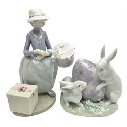Two Lladro figures comprising, Easter Bunnies, no 5902 and Easter Bonnets, no 5852, both with original boxes, largest example H22cm