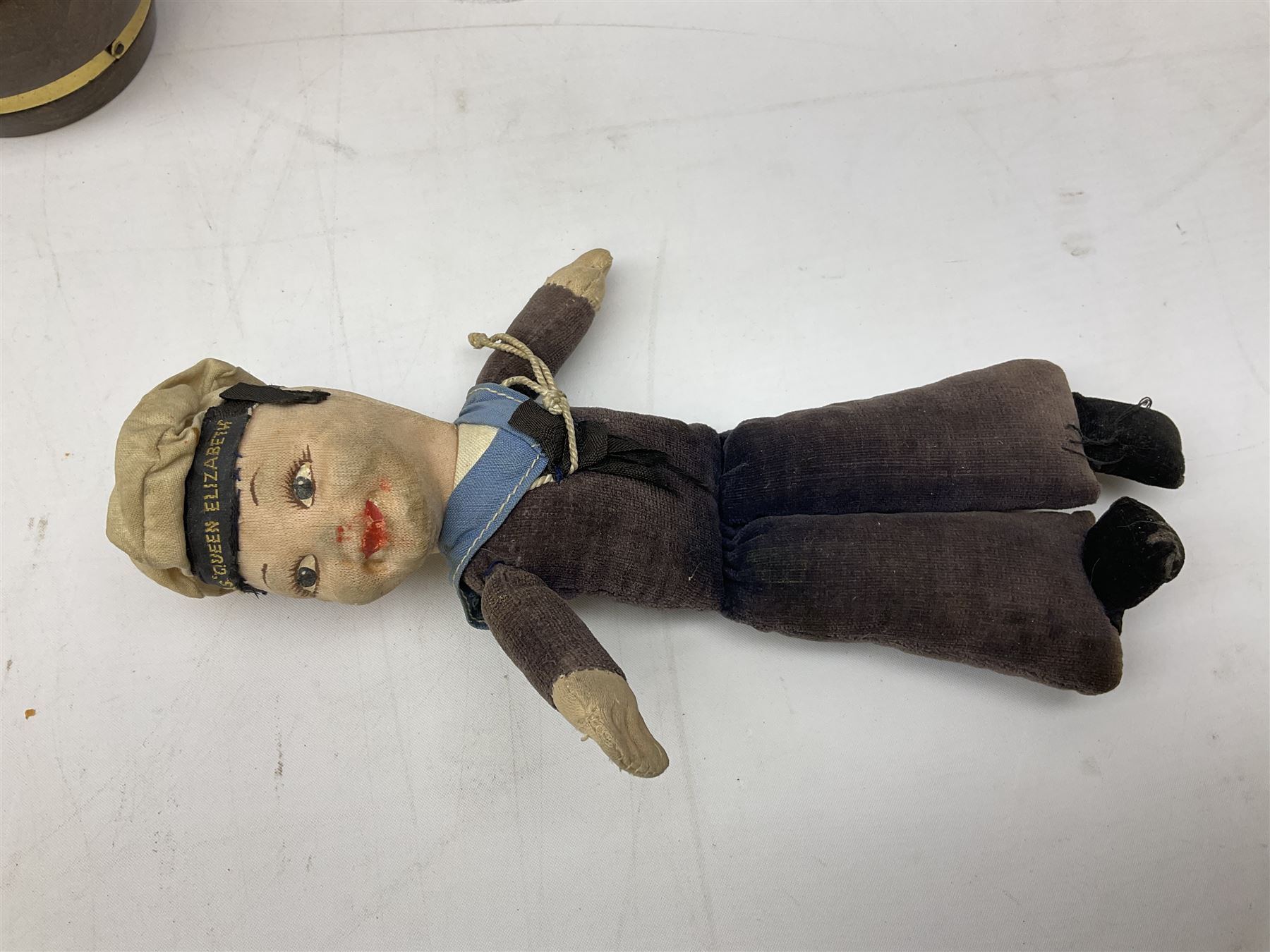 Silver 1969 Cunard RMS Queen Elizabeth maiden voyage commemorative medallion, in original Slade, Hampton & Son case with certificate, two Stratton R.M.S Queen Elizabeth mirror compacts, Stratton R.M.S Queen Mary compact, mid 20th century P&O Canberra Round World Voyage miniature globe, S.S Oriana ash tray modelled as a barrel, Norah Wellings sailor doll, and other maritime and shipping memorabilia 