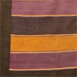 South West Persian Qashqai flatweave kilim, field decorated with bold horizontal bands in shades of aubergine, plum and orange, ochre, olive and lilac, interspersed with narrow registers of diagonal chevron motifs in cream and dark brown, framed by brown end panels, with fringe ends 