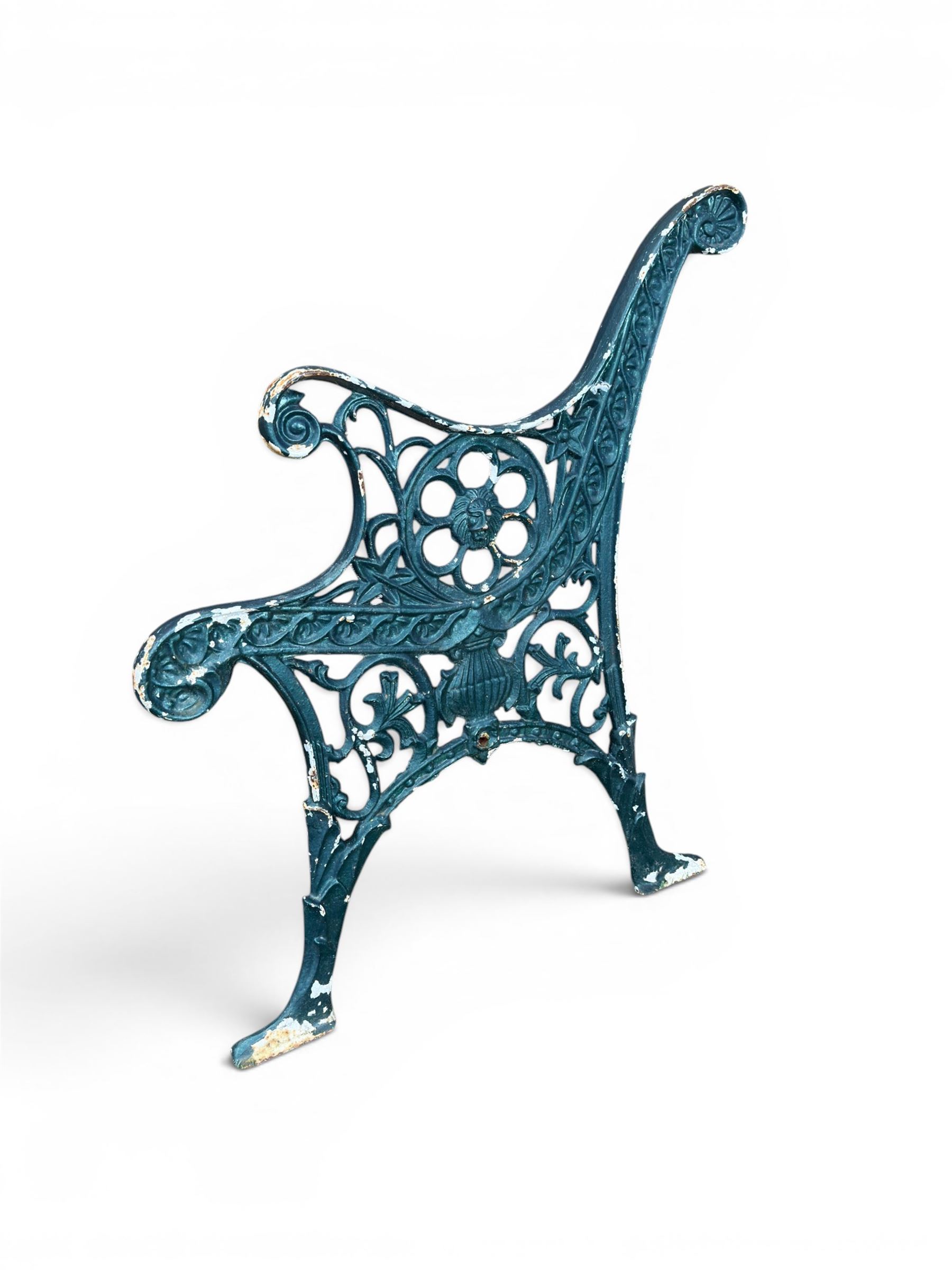 Pair of ornate painted cast iron bench ends, painted in green