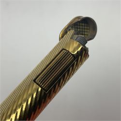 Dunhill gold plated dress lighter, in original fitted case with paperwork, together with a Dunhill rolagas lighter