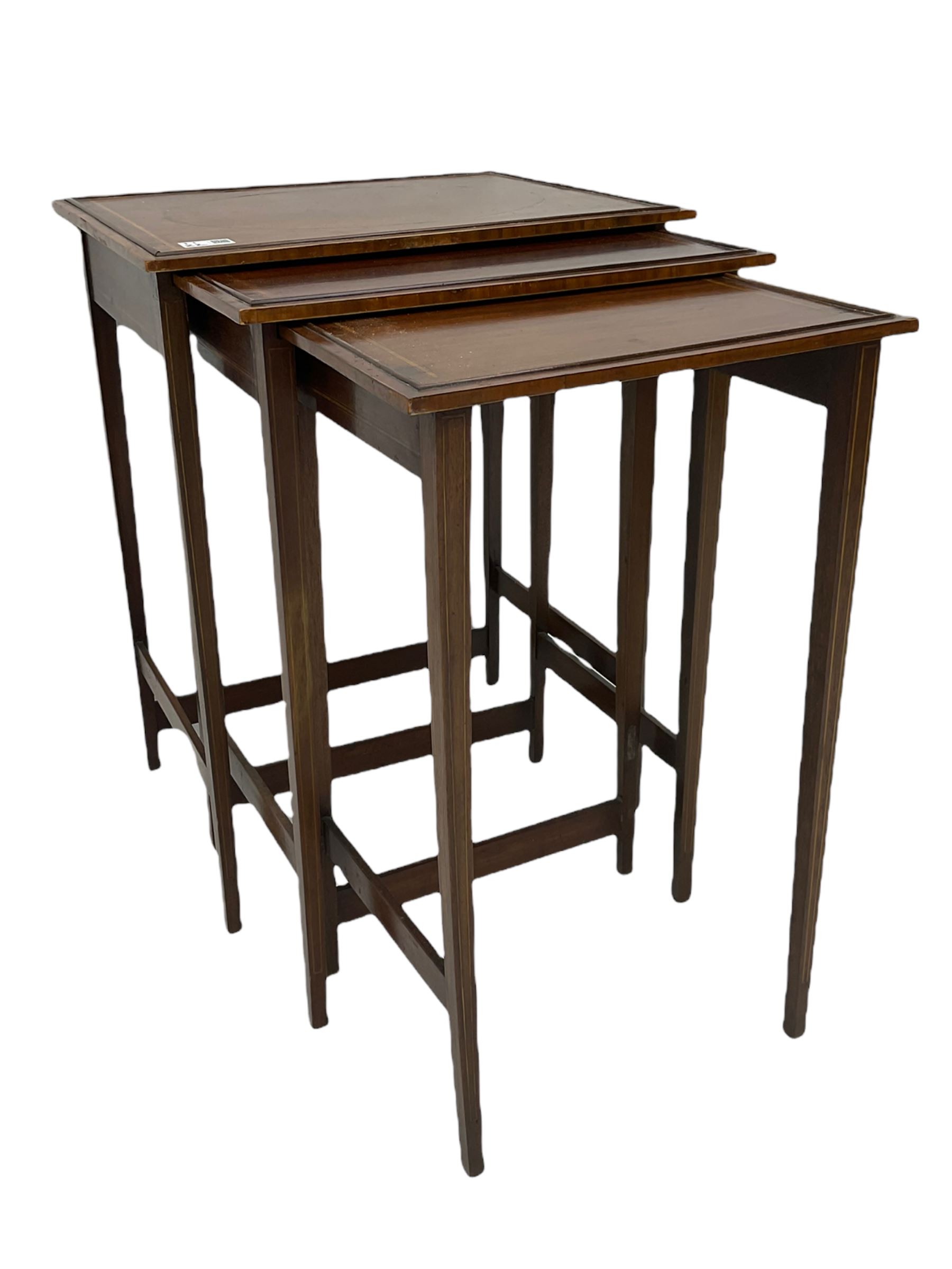 Edwardian mahogany wall hanging corner display cabinet, projecting dentil cornice over astragal glazed door (W56cm, H93cm), and an Edwardian mahogany nest of three tables (46cm x 36cm, H60cm)