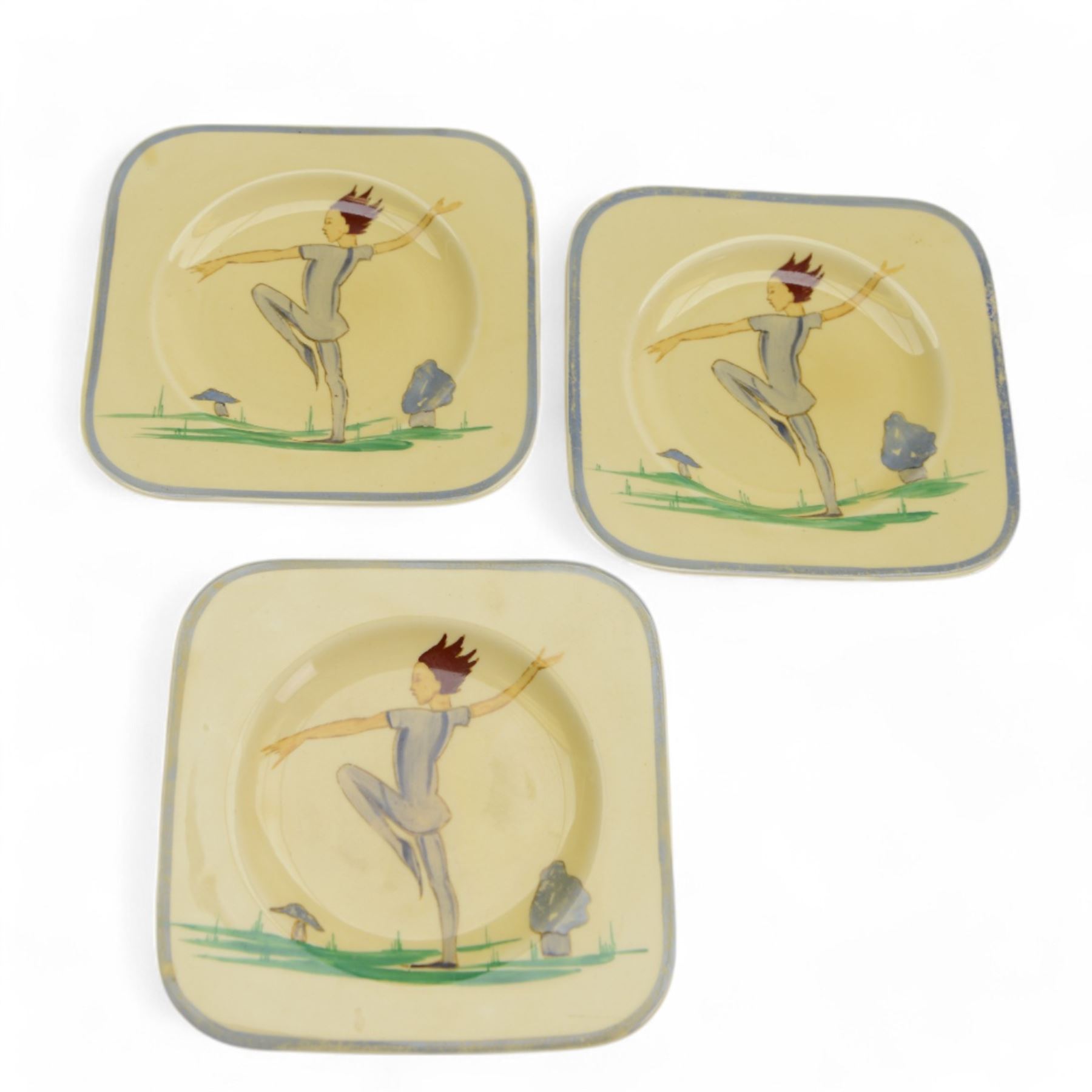 Susie Cooper Puck pattern twin-handled tray and four serving plates, decorated with a dancing figure and toadstools, tray L32cm plates D13cm