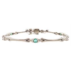 18ct white gold emerald and round brilliant cut diamond link bracelet