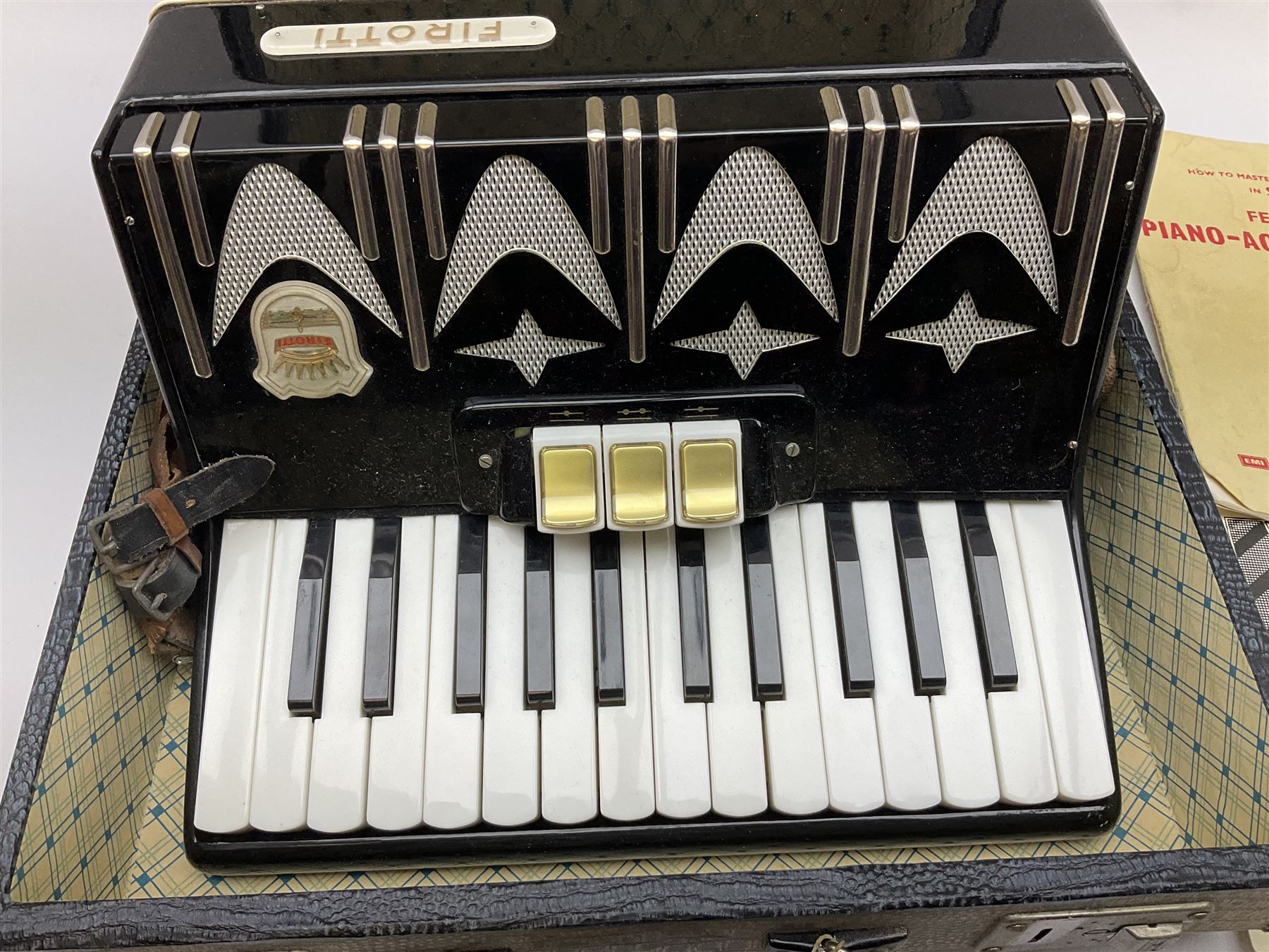 GDR Firotti piano accordion with black and silver case, sixteen keys and forty-eight buttons L38cm; in simulated reptile skin case with sheet music