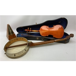  A cased Stentor Student violin and bow, together with a J E Dallas banjo with inlaid mother of pearl star and disc marker detail to neck, (a/f), and a wooden cased metronome.   