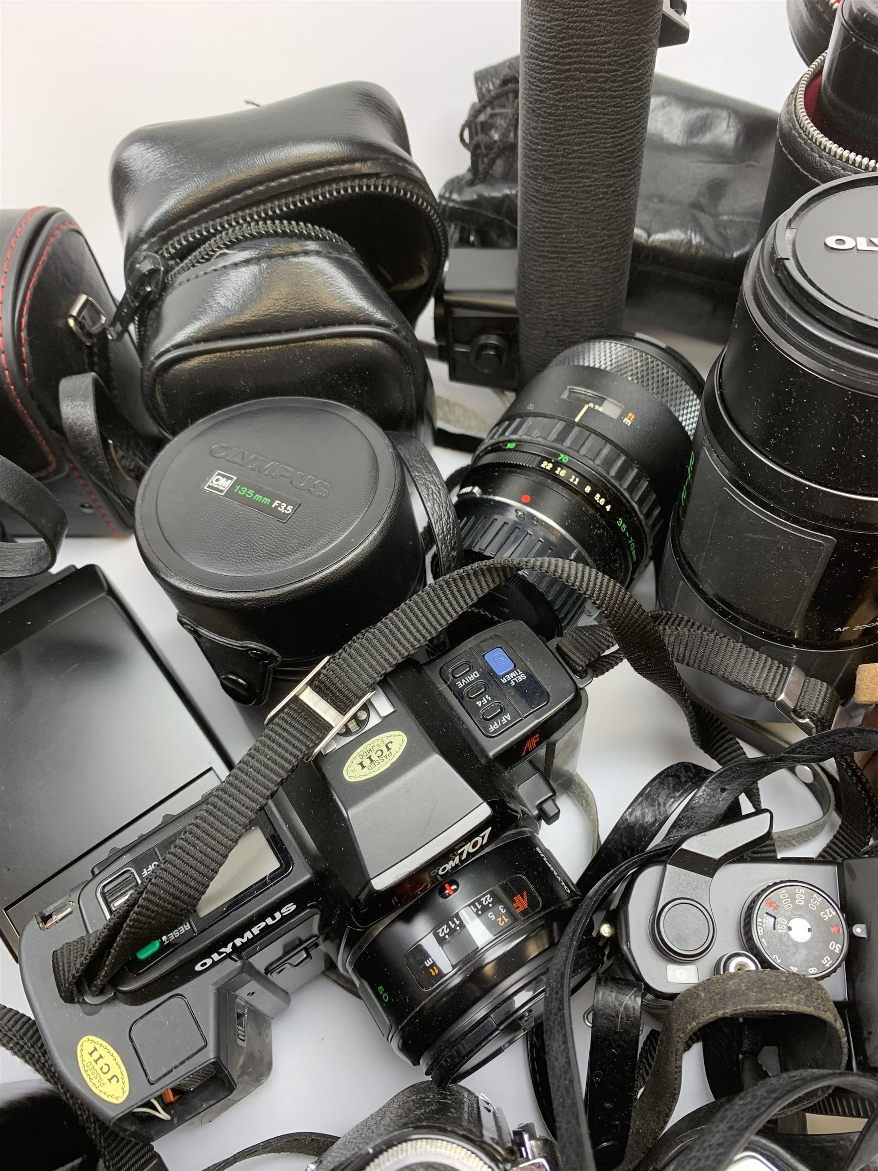 Vintage cameras lenses and accessories including Olympus 'OM10' camera body, Olympus 'OM4' camera, 'Olympus OM-System Zuiko auto-zoom 35-70mm 1:4' lens, various other lenses, tasco binoculars etc, in one box