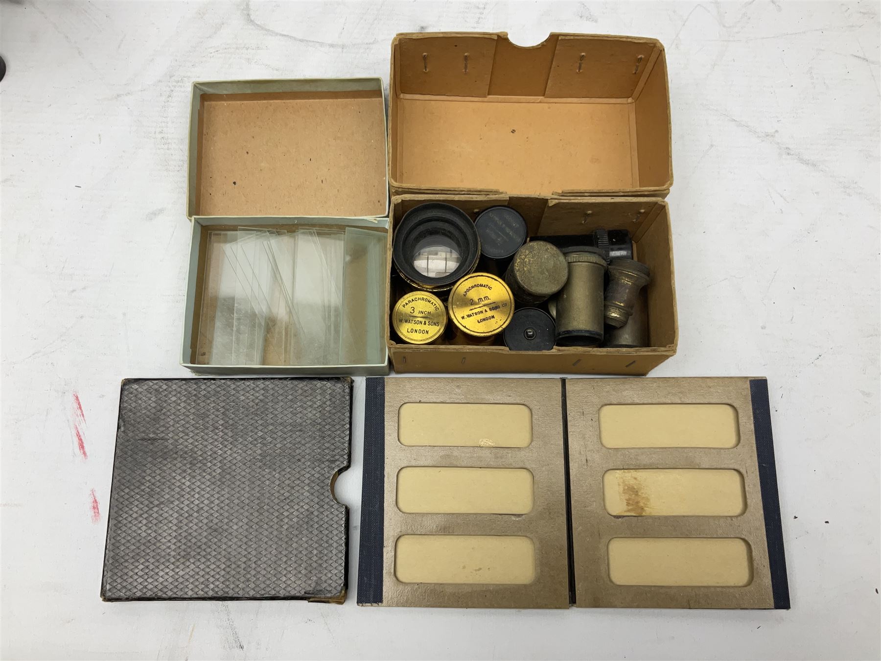 19th century brass and black japanned monocular microscope by W. Watson & Sons Ltd. 313 High Holborn, London serial no.24788 with rack and pinion focussing on tripod base H31cm; in fitted mahogany case retailed by A.H. Baird Scientific Instrument Makers Edinburgh; quantity of additional lenses and accessories; together with another similar uncased monocular microscope by W. Watson serial no.58379 (2)