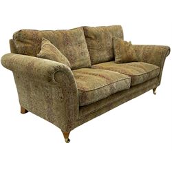 Parker Knoll two seat sofa, upholstered in natural beige patterned fabric