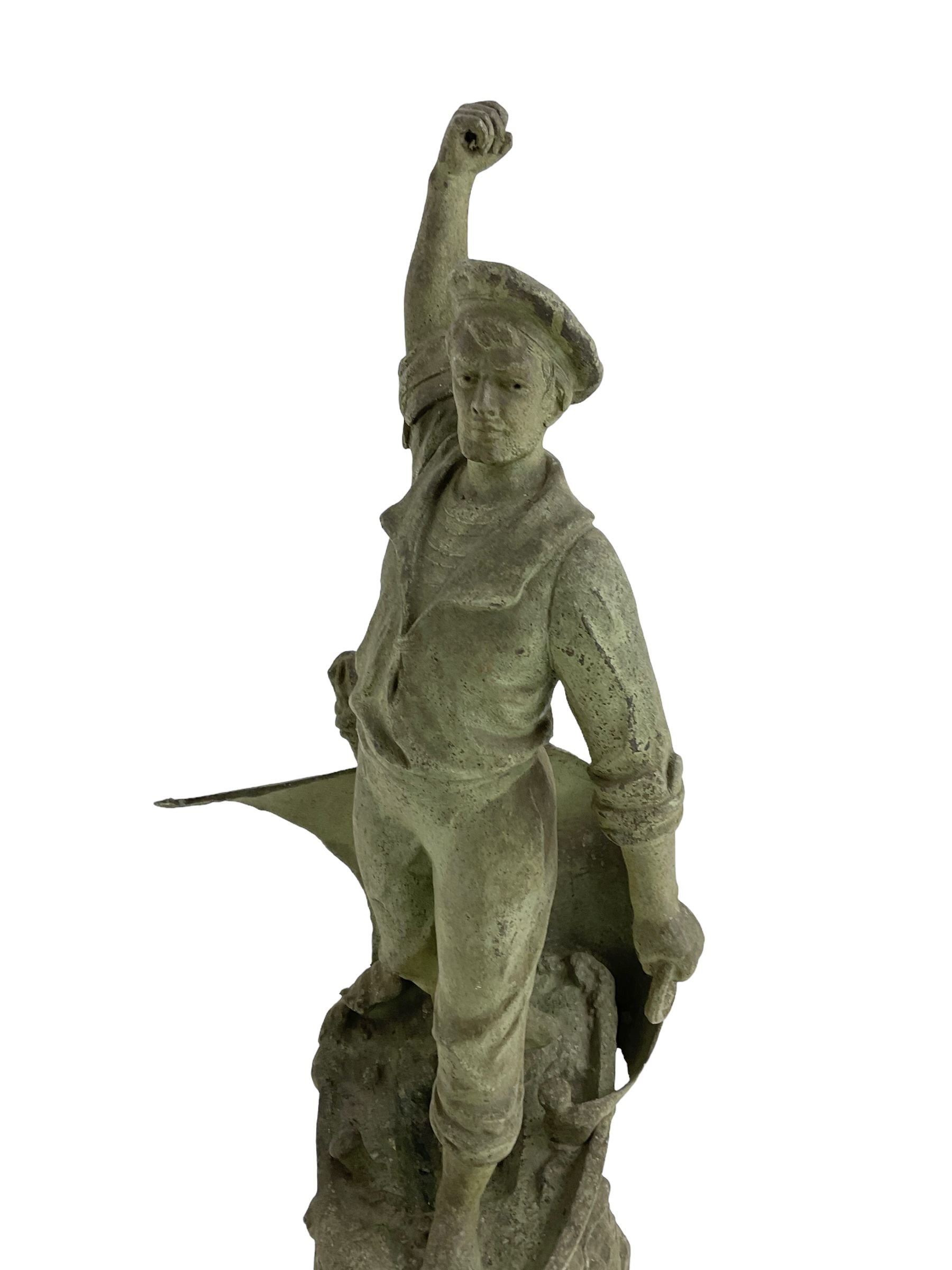Edwardian - Large figural clock with a Verdigris finish mounted on a mahogany plinth, detailed depiction of a fisherman in a sailing boat entitled 