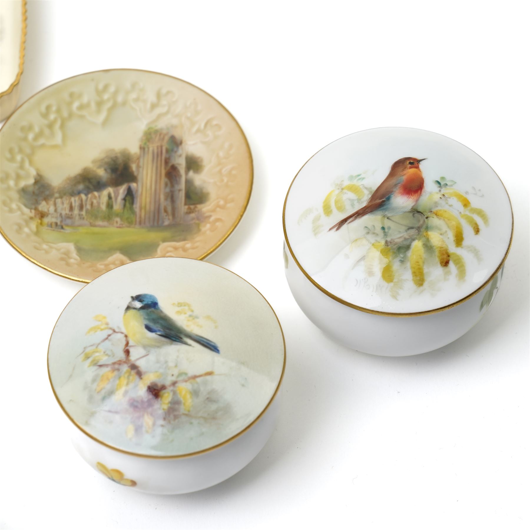 Nine hand-painted Royal Worcester items, comprising two trays painted with Worcester landscapes including 'Edgar Tower', a circular blush ivory tray painted with 'St Mary's Abbey - York', two trays and two covered trinket dishes painted with birds by Ernest Barker and H Powell, miniature jug painted by J Allen, and a Hadley Ware ewer, H11cm (9)