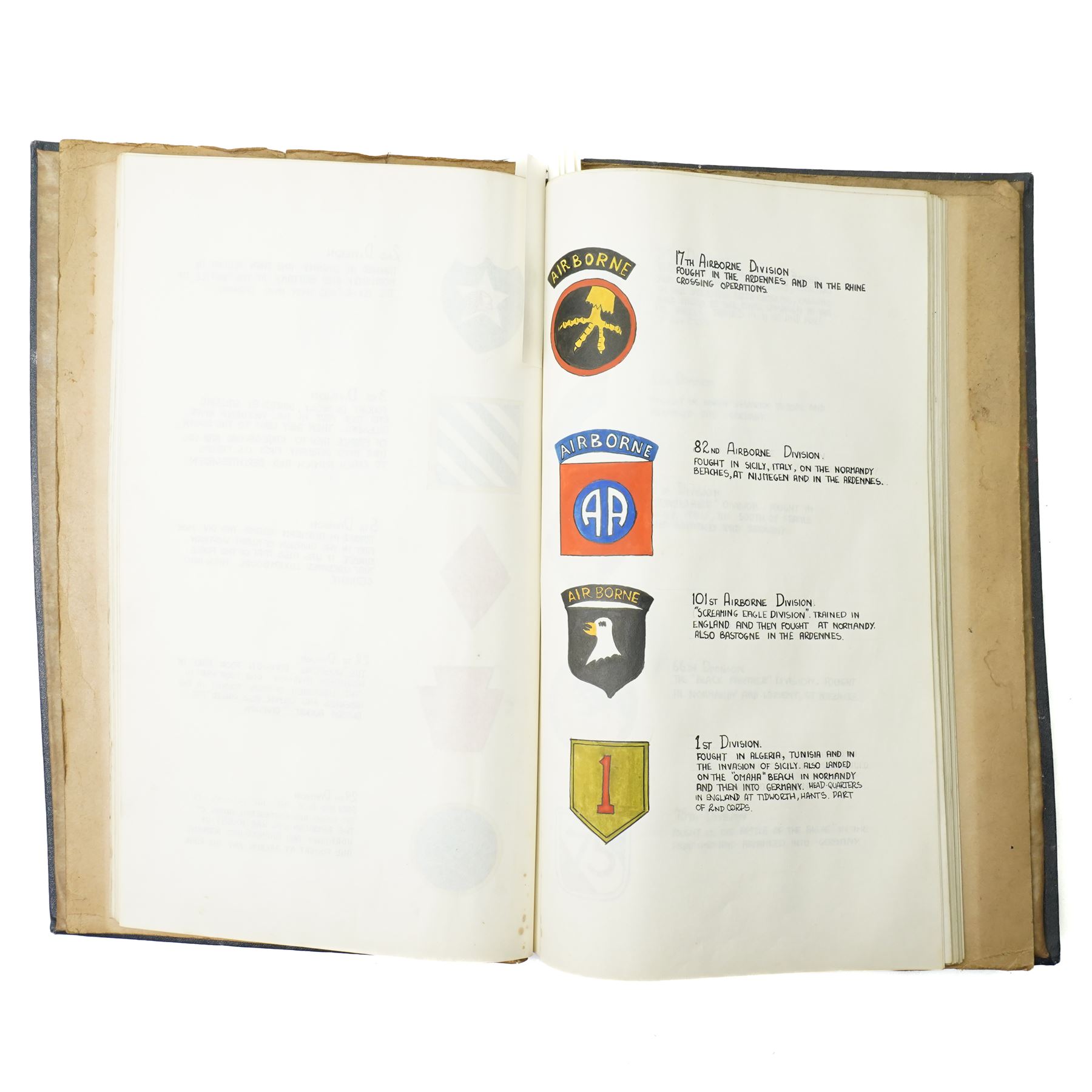 Folder containing a comprehensive collection of watercolours of WWII military emblems including U.S.Army Insignia, British Chevrons, Division Insignia, U.S. Army Divisions, Medals, Weapons etc with typed information, approximately sixty five pages with many illustrations  probably late 1940s/ early 1950s 