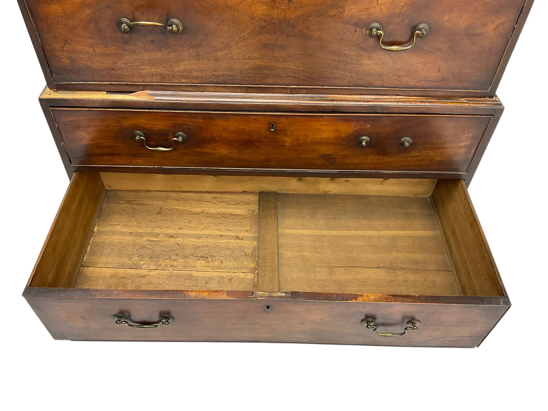 George III mahogany chest on chest, projecting cornice over plain frieze, fitted with two short and six long graduating cock-beaded drawers, on bracket feet
