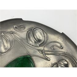 Liberty & Co Tudric pewter Bollelin tray, designed by Archibald Knox, of circular form with shaped edge, cast in relief with foliate tendrils surrounding a green enamel cartouche, impressed beneath Made by Library & Co English Pewter 044, D25.5cm