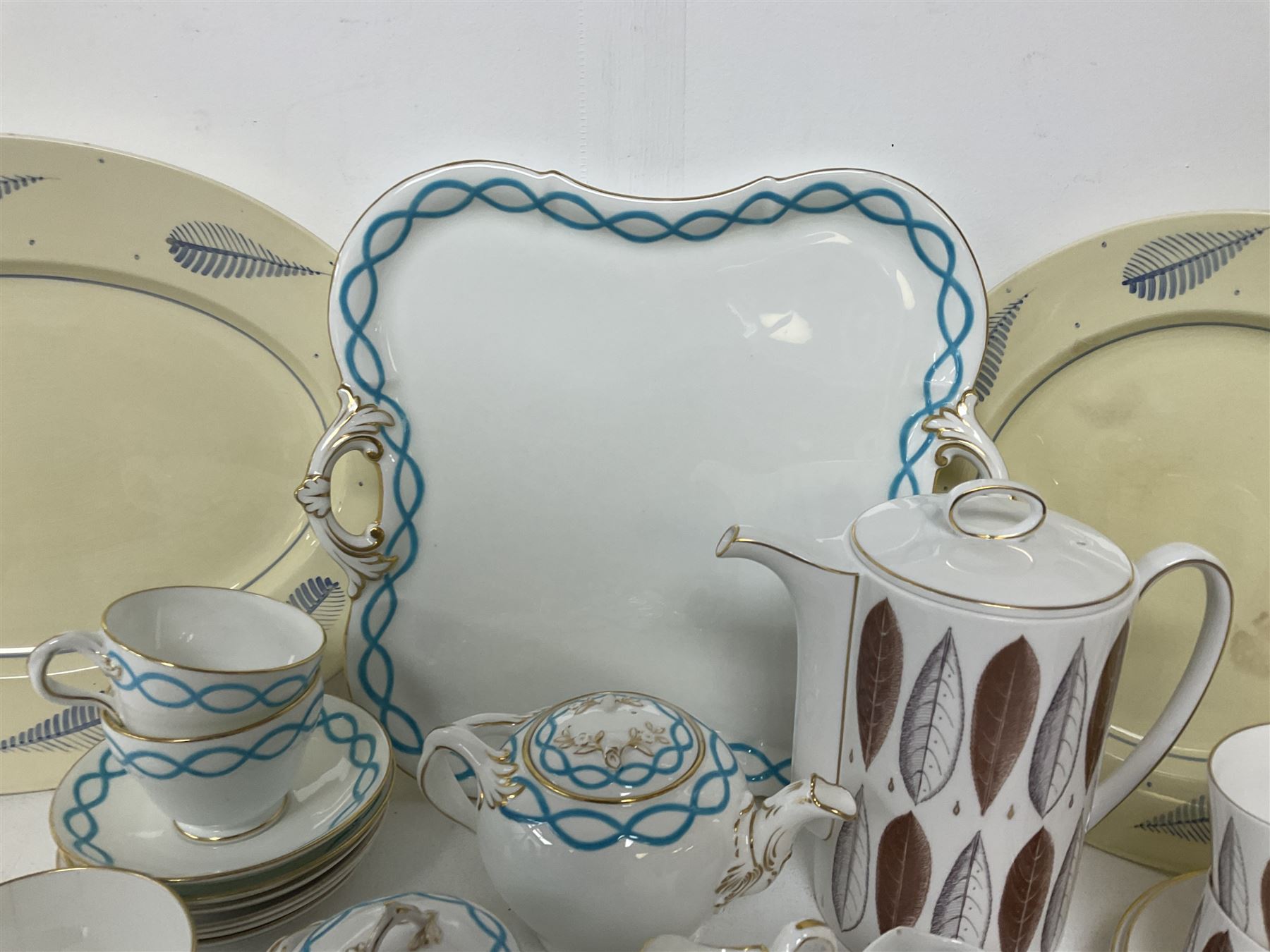 Victorian cabaret set,  comprising teapot, milk jug, covered sucrier, open sucrier, two cups and saucers upon a tray, together with Susie Cooper Hyde Park pattern coffee set, comprising coffee pot, four coffee cans and saucers, dessert plates and three plates in a similar design 