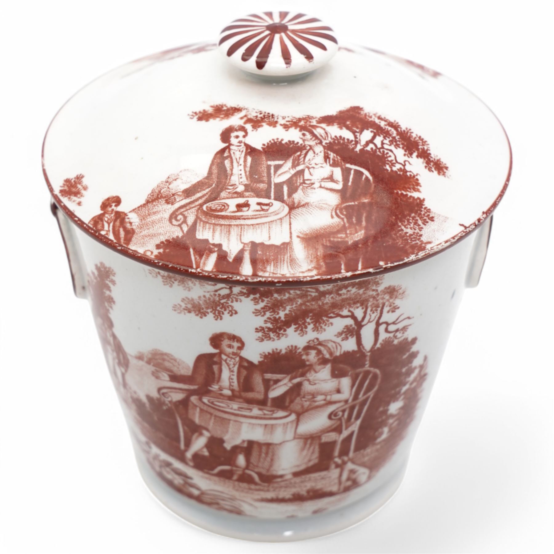 Early 19th century cream pail and cover printed in terracotta with figures sitting in a garden taking tea and with faux loop handles, with old label to the base 'Shorthose & Co. Staffordshire' H9cm