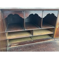 George III mahogany bureau, the conch inlaid fall front enclosing pigeon holes, shelves and central cupboard with inlaid flower motif, four graduating cock-beaded drawers below each with brass handles, lower moulded edge over shaped bracket feet