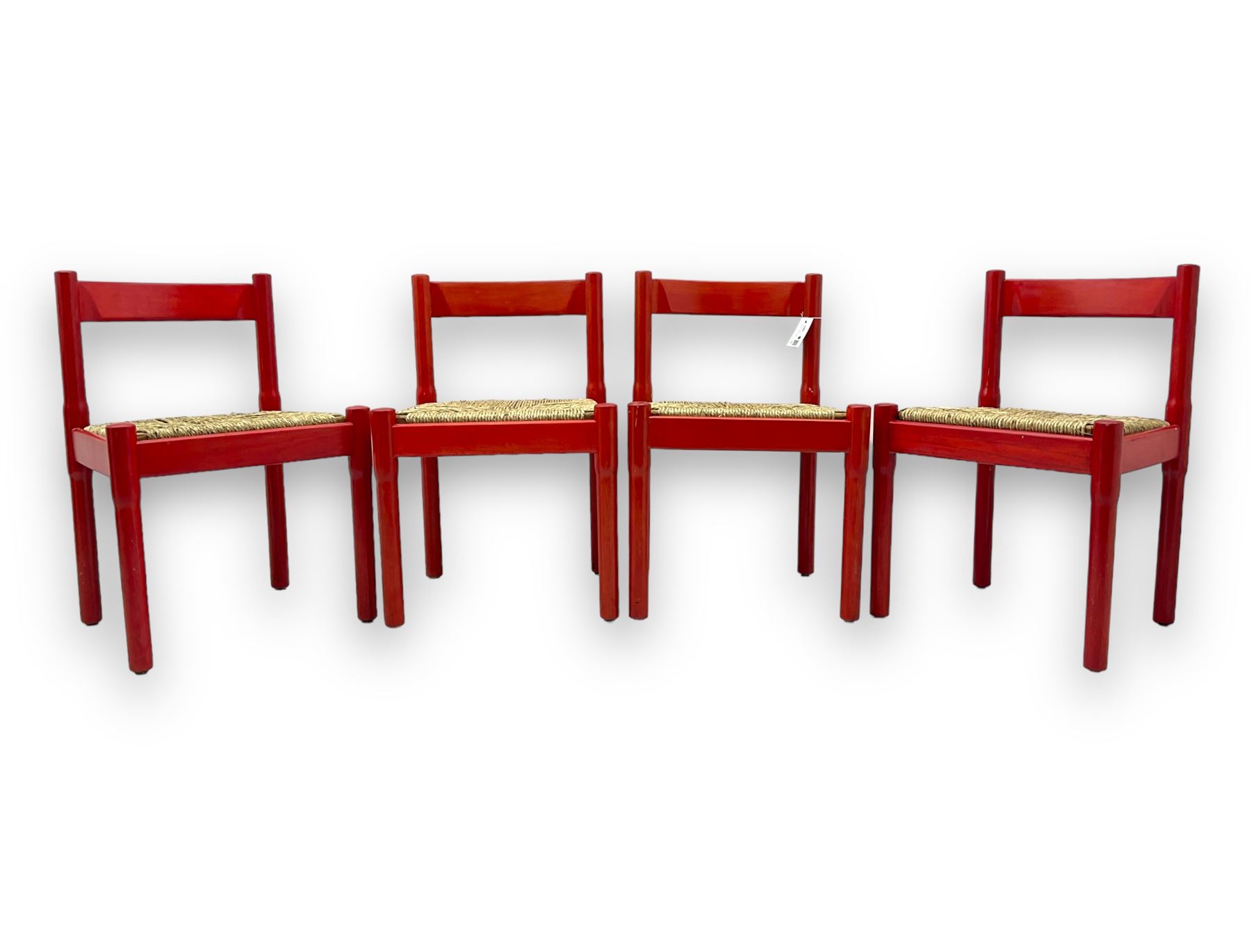 Vico Magistretti - mid-20th century circa. 1970s set of four beech framed dining chairs in red finish, with drop-in rush seats
