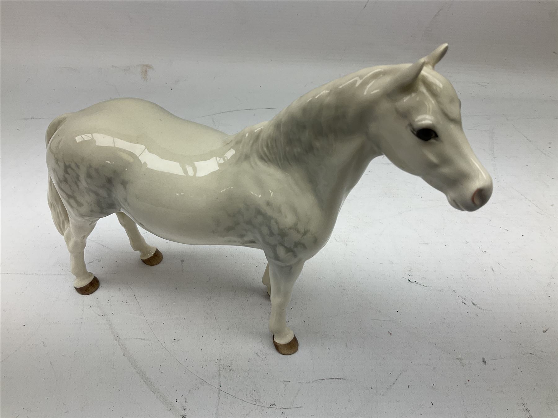 Seven Beswick figures of horses, including Connemara pony in grey no.1641, Arab in bay no.1265, large foal in grey no.947 etc, together with a Goebel figure of a horse (8)