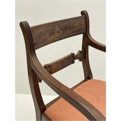 Regency mahogany elbow chair, the figured cresting rail over carved and figured middle rail, moulded uprights and downswept arms with scrolling terminals, turned and reeded supports 