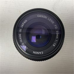 Seven camera lenses, including 'Pentacon 4/300' lens, serial no 8613038, 'Hoya HMC Zoom 28-85mm 1:4' lens serial no 215421, Minolta MD zoom 70-210mm 1:4' lens serial no 1022848, etc 