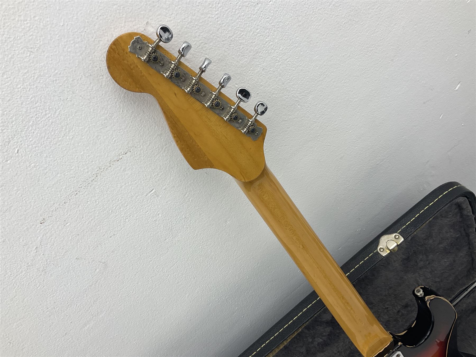 Fender style sunburst electric guitar with manuscript mark 'Zenta Stratocaster 1963' L97cm; in hard carrying case; another similar unmarked sunburst electric guitar; in gig bag; and Fender Frontman Amplifier, serial no.M473406 (3)