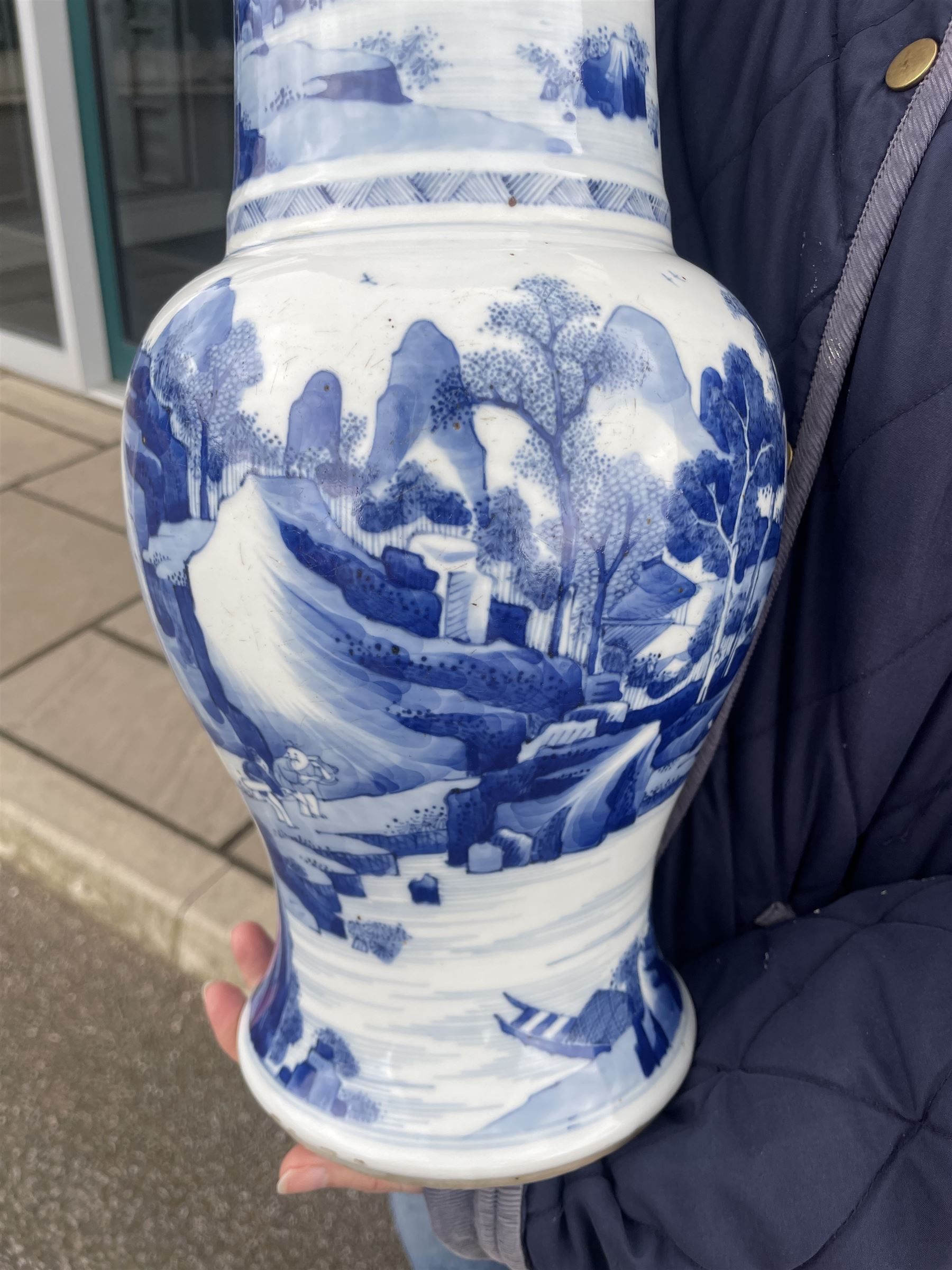 Qing Dynasty Yen Yen blue and white vase in the Kangxi style decorated with a lake landscape surrounded by rocky cliffs, figures in a boat and on the shore H45cm 