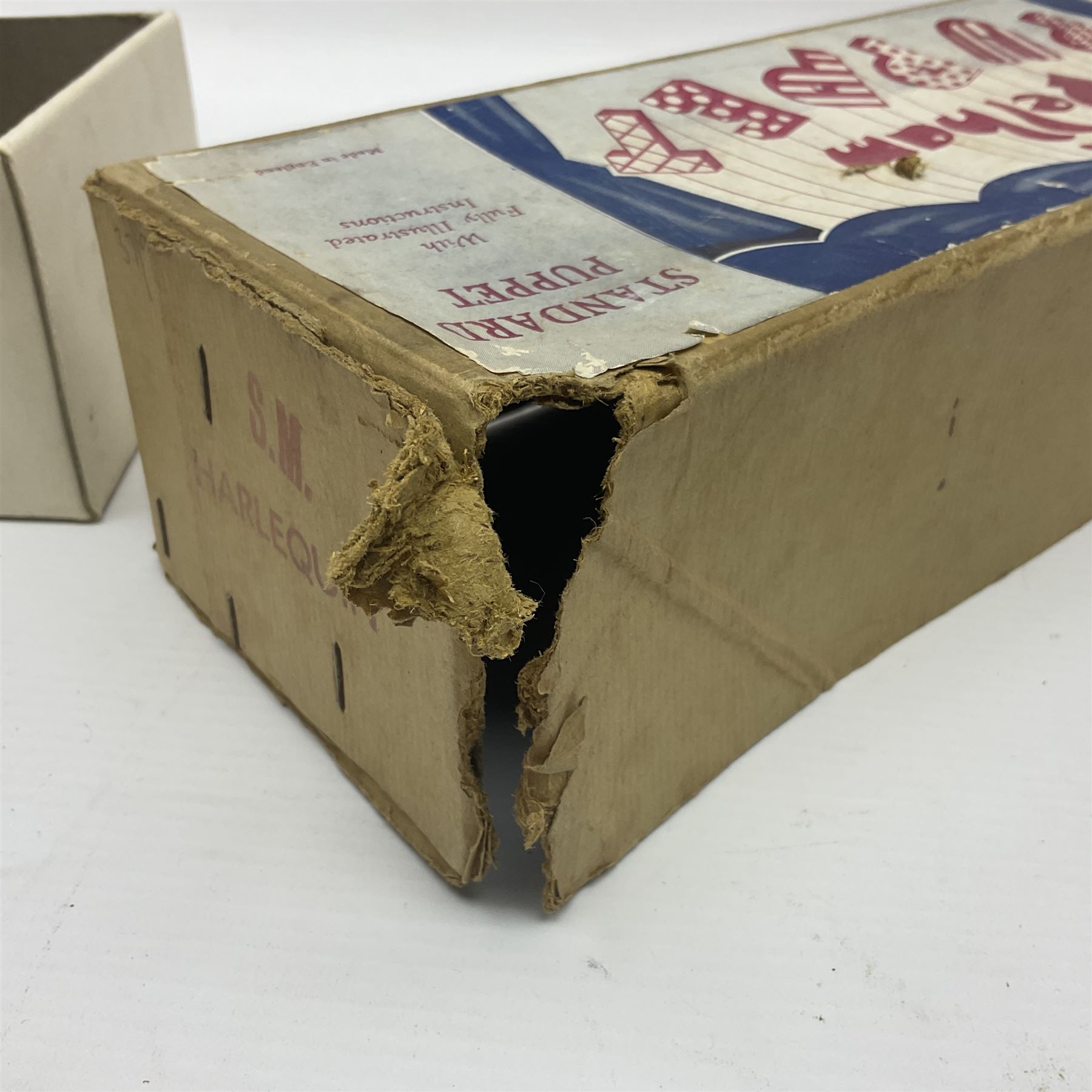 Pelham Puppet - a rare type SM Harlequin circa 1950s with painted black face mask, black felt hat, green ruff and red white chequered suit, H31cm; in original box with instructions 