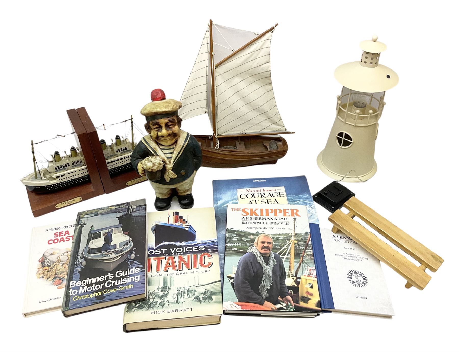 Nautical themed decorative items, to include Titanic book ends, model boat, books, lighthouse lamp etc in one box