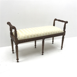  Regency style mahogany window bench seat, carved scrolled arms, six turned and fluted supports, W116cm, H66cm, D41cm  