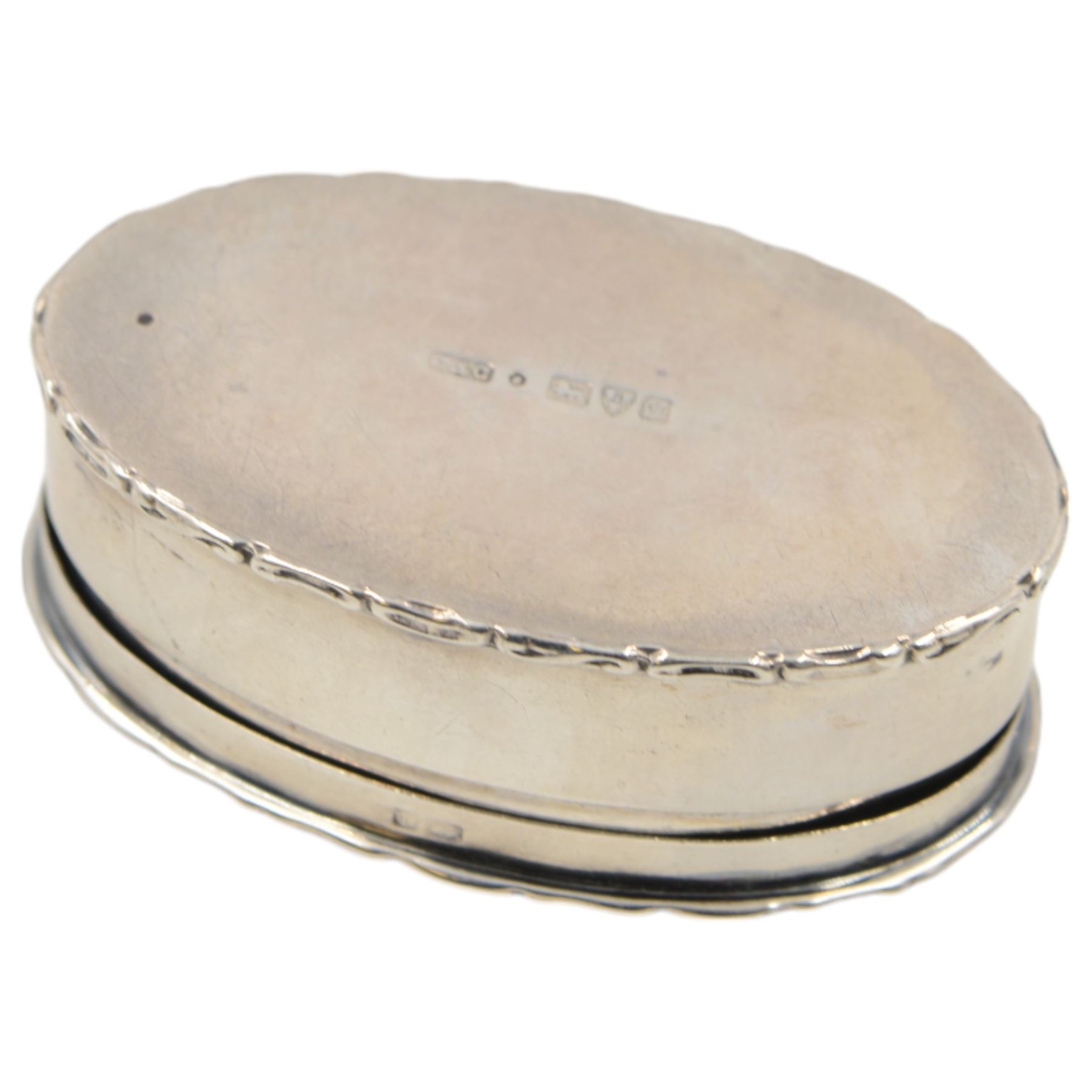 Edwardian silver trinket box, of oval form with embossed scroll rim, the hinged cover inset with a jasperware roundel depicting a classical scene, hallmarked Cohen & Charles, Chester 1905, H2.5cm, W7.5cm