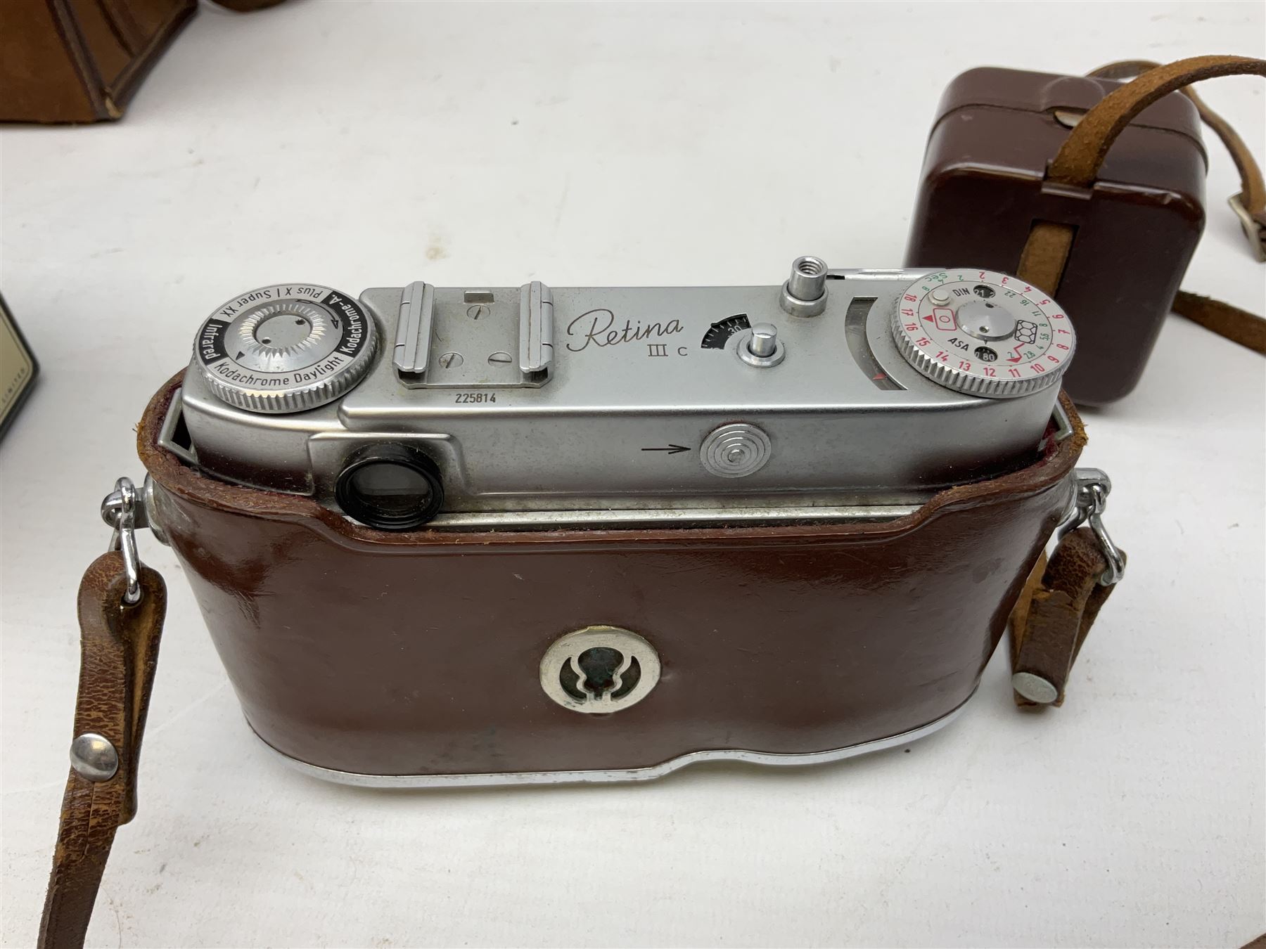 Kodak Retina III camera with 'Schneider-Kreuznach 3977724 Retina-Xenon C f:2/50mm' lens in leather case, and Brownie Model D in leather case