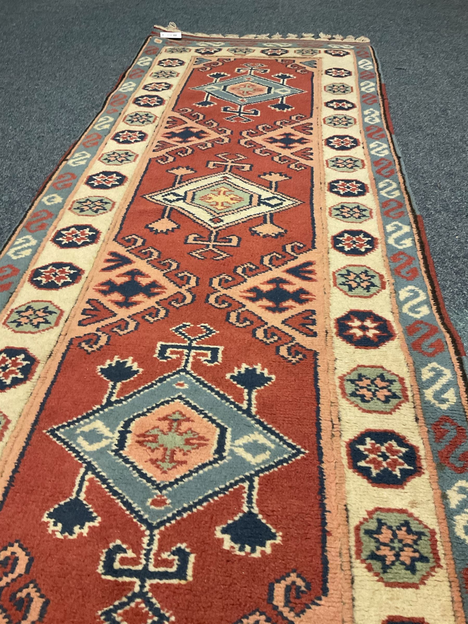 Turkish style runner rug, triple medallion surrounded by red field