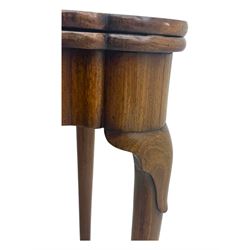 George III mahogany fold-top card table, shaped rectangular top opening to reveal a baize-lined surface, supported by a concertina pull-out concertina rear mechanism, raised on cabriole supports with foliate carvings terminating in pad feet