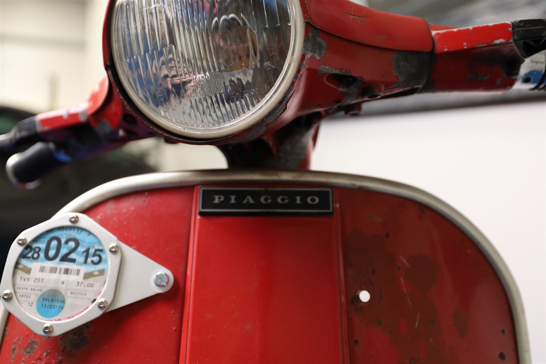 1979 Piaggio Vespa 200 Scooter

• Registration: TVY 25T
• Date of first registration: 1979
• Engine: 197cc petrol
• Odometer reading: 9,960 miles
• Colour: Red
• V5C: Present
• Keys: One

A 1979 Piaggio Vespa 200, registered TVY 25T and finished in red. Powered by a 197cc petrol engine, the scooter displays 9,960 miles on its Veglia Borletti odometer, although this mileage has not been independently verified.

The Vespa 200 is one of the larger-capacity models in the classic Vespa range, combining the marque’s distinctive pressed-steel construction with a practical 197cc engine and traditional handlebar gear change.

This example is presented in largely original and unrestored condition, retaining its period bodywork, Piaggio and Vespa badging, original-style controls and Yankee-branded dual seat.

The scooter shows extensive age-related wear throughout, including paint loss, scratches, surface corrosion and deterioration to the bodywork, including a perforation to the inner legshield.

This vehicle forms part of the Estate of the Late John Sills and is offered for sale by the Executors, confirming a genuine reason for sale.
