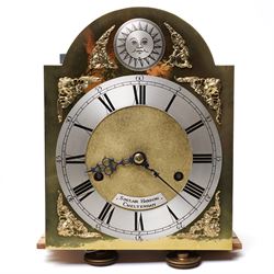 Mouseman - Oak 8-day grandmother clock, with a high quality weight driven movement and dial by Sinclair and Harding & Co of Cheltenham (No 477), brass break-arch dial with pierced steel hands, cast spandrels and a matted dial centre, silvered chapter with Roman numerals and minute track, dial pinned to  a two train rack striking movement, striking the hours on a cast bell, case with a full length glazed door and visible brass cased weights and conforming brass cased cylindrical pendulum. Signature carved mouse to the top of the arch of the case, from the workshop of Robert Thompson of Kilburn
With key.
Longcase.