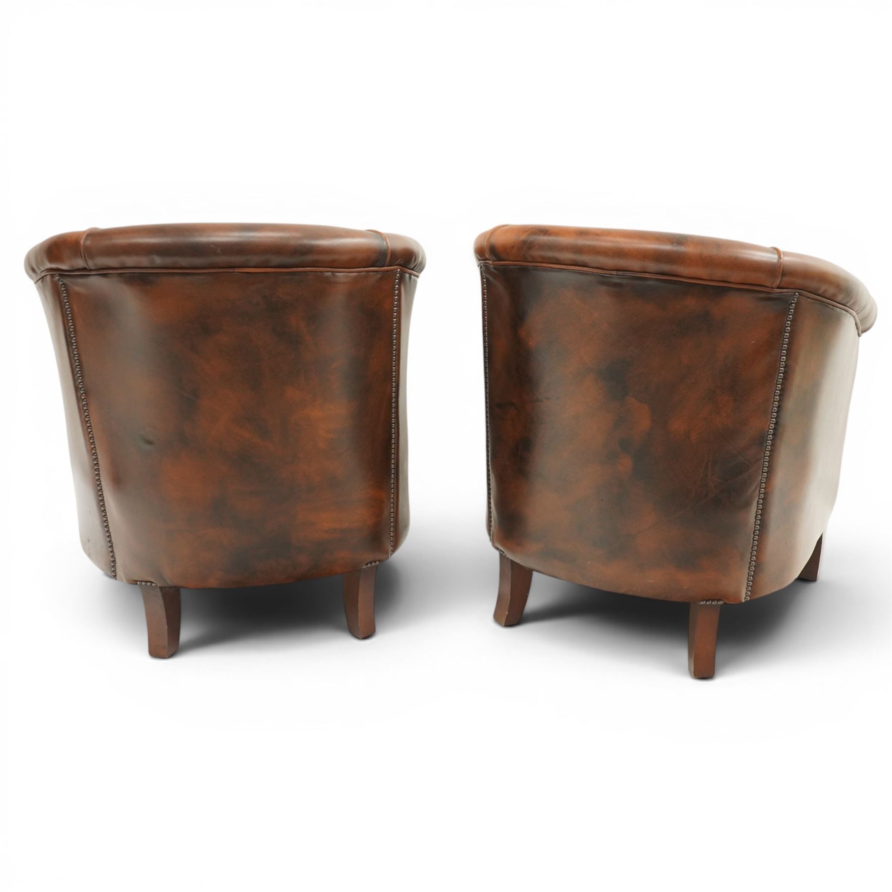 Pair of brown leather tub chairs, with downswept arms with brass studded trim, fixed cushion seat, raised on square tapering supports 