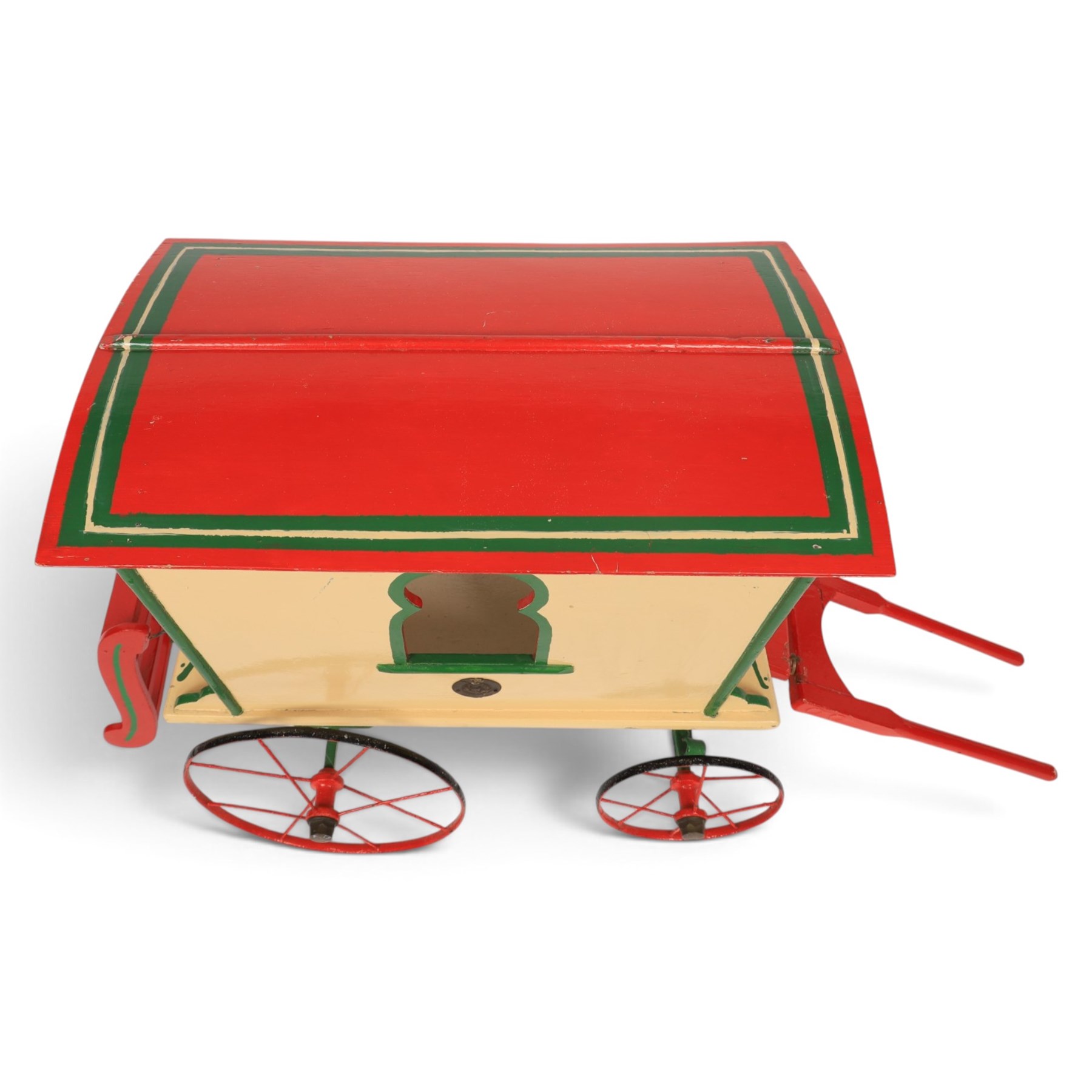 G & J Lines wooden gypsy caravan model, painted in cream with red roof, wheels and green detailing, H51cm, L89cm