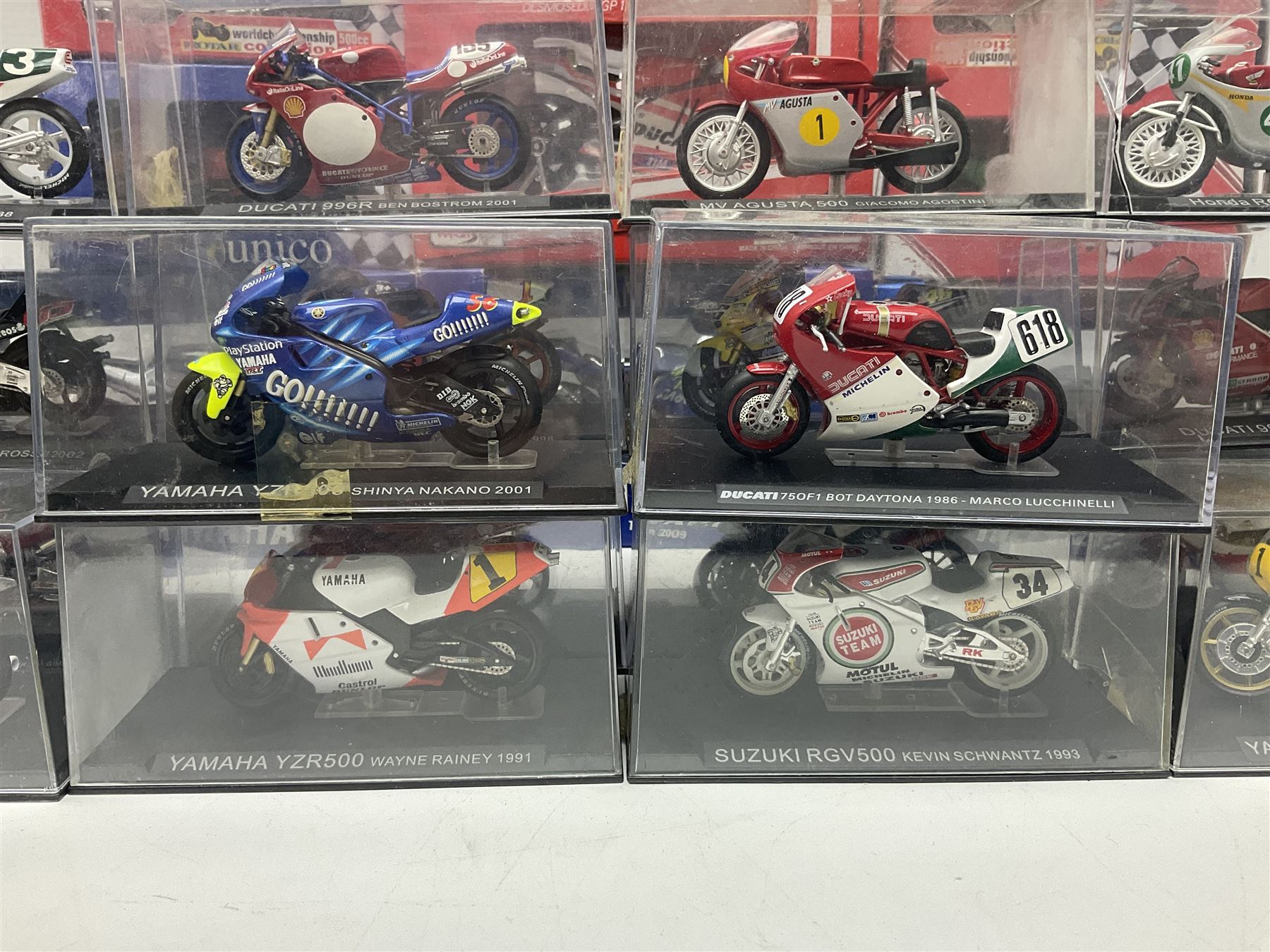 Fifty-one die-cast models of motorcycles by Maisto, Protar Italeri, Welly etc; many in perspex display boxes, some in window boxes and some unboxed